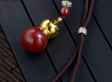 Golden Cinnabar Gourd Pendant with Sacred Mantra Projection
