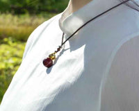 Golden Cinnabar Gourd Pendant with Sacred Mantra Projection