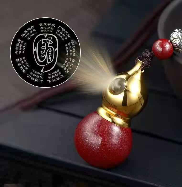 Golden Cinnabar Gourd Pendant with Sacred Mantra Projection