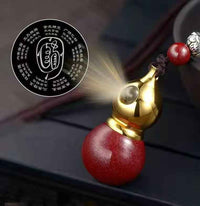 Golden Cinnabar Gourd Pendant with Sacred Mantra Projection